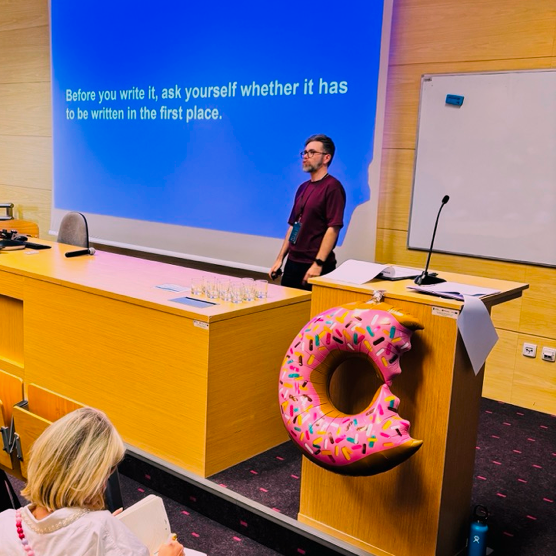 A speaker at CAKE conf stage